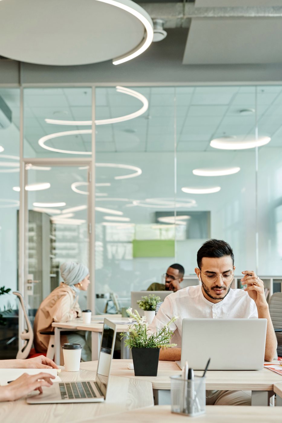 An engineer at work in a shared office